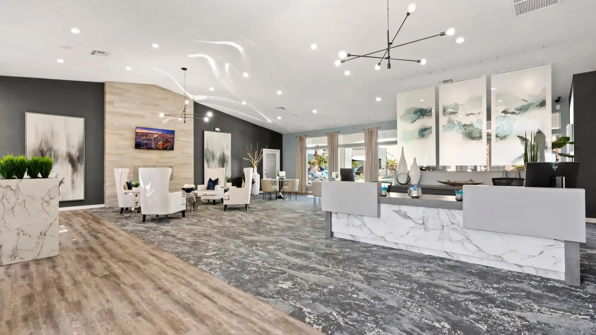 Millennium East Apartments full view of leasing office with reception area and windows showing outside view
