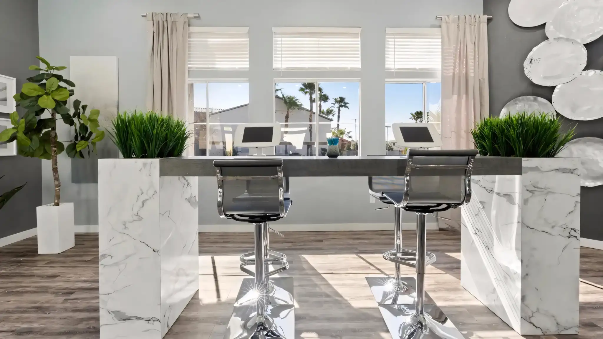 Millennium East Apartments leasing office reception counter with tablets